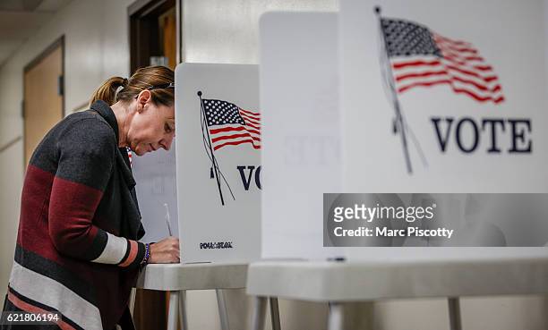 Kerry Hinton of Lakewood, Colorado fills out her ballot at the Jefferson County Fairgrounds on November 8, 2016 in Golden, Colorado. Voters go to the...