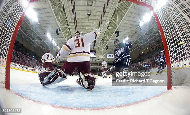 Joe Woll of the Boston College Eagles makes a shoulder save against the New Hampshire Wildcats during NCAA hockey at Kelley Rink on November 8, 2016...