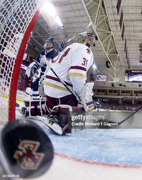 Jason Salvaggio of the New Hampshire Wildcats celebrates after he scored a goal against Joe Woll of the Boston College Eagles during NCAA hockey at...