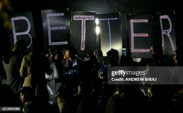 Anti Trump protesters gather outside the White House in Washington to wait the results of the US presidential election on November 8, 2016. Millions...