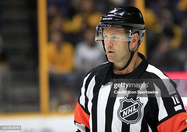 Referee Kyle Rehman is shown during the NHL game between the Nashville Predators and the Ottawa Senators, held on November 8, 2016 at Bridgestone...