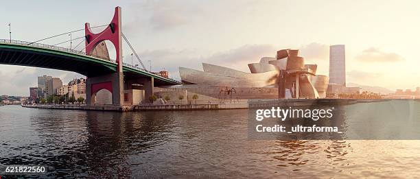 guggenheim museum bilbao and iberdrola tower at sunset - vizcaya province stock pictures, royalty-free photos & images