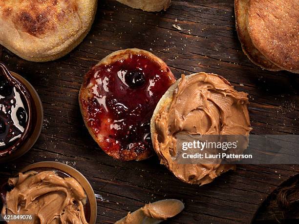 toasted english muffin with peanut butter and jam - spread imagens e fotografias de stock