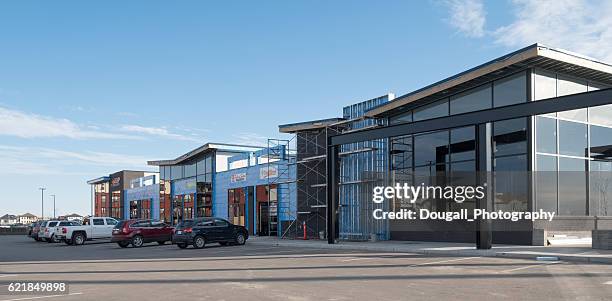 new strip mall under construction in saskatoon - saskatoon stock pictures, royalty-free photos & images