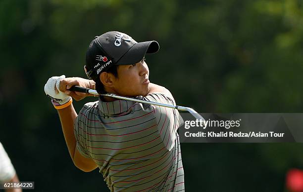 Pavit Tangkamolprasert of Thailand plays a shot during practice for the Resorts World Manila Masters at Manila Southwoods Golf and Country Club on...