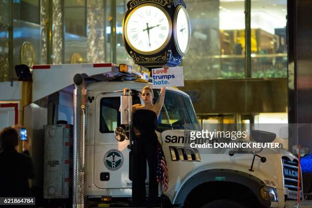 Musician Lady Gaga stages a protest against Republican presidential nominee Donald Trump on a sanitation truck outside Trump Tower in New York City...