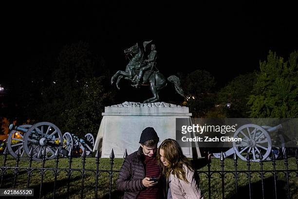 People wait for 2016 election return results in front of The White House on November 9, 2016 in Washington, D.C., United States.