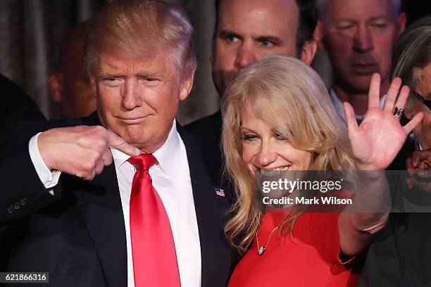 Republican president-elect Donald Trump along with his campaign manager Kellyanne Conway acknowledge the crowd during his election night event at the...
