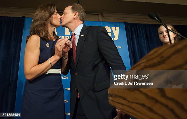 Senator Pat Toomey of Pennsylvania kisses his wife Kris Toomey as he prepares to speak to supporters following his election victory in a...