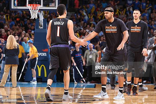 Devin Booker and Jared Dudley of the Phoenix Suns react during the game against the Oklahoma City Thunder on October 28, 2016 at the Chesapeake...