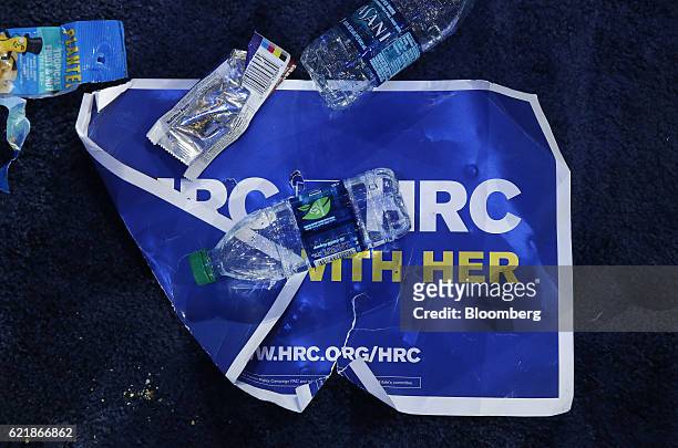 Campaign sign sits covered in trash after an election night party for 2016 Democratic Presidential Candidate Hillary Clinton at the Javits Center in...