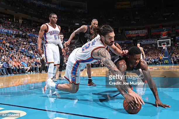 Steven Adams of the Oklahoma City Thunder and Eric Bledsoe of the Phoenix Suns chase after a loose ball on October 28, 2016 at the Chesapeake Energy...
