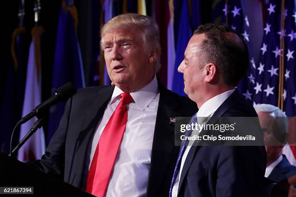 Republican president-elect Donald Trump and Reince Priebus, chairman of the Republican National Committee, embrace during his election night event at...