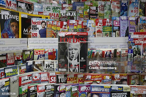 The face of Donald Trump, U.S. President elect, sits on the cover of Forbes magazine, published by Forbes Media LLC, among other media publications...