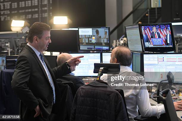 Trader watch the speech of Donald Trump, after he wins the U.S. Presidential elections, at the Frankfurt Stock Exchange on November 9, 2016 in...