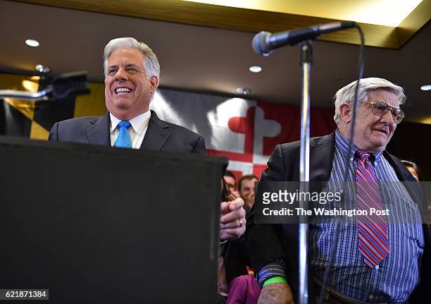 Newly elected Maryland Republican Governor-elect Larry Hogan, left, talks to his supporters with his father Lawrence J. Hogan Sr., by his side during...