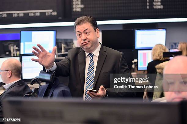 Analyst Robert Halver reacts at the Frankfurt Stock Exchange on November 9, 2016 in Frankfurt, Germany. Stock markets around the world reacted with...