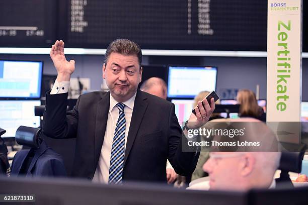 Analyst Robert Halver reacts at the Frankfurt Stock Exchange on November 9, 2016 in Frankfurt, Germany. Stock markets around the world reacted with...