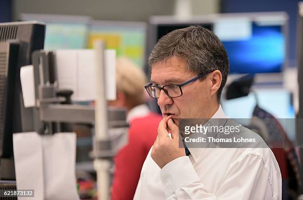 Trader reacts at the Frankfurt Stock Exchange on November 9, 2016 in Frankfurt, Germany. Stock markets around the world reacted with volatility to...