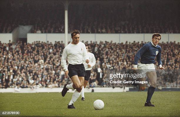 Jimmy Greaves of Spurs outpaces David Nish of Leicester City during a First Division match between Tottenham Hotspur and Leicester City at White Hart...