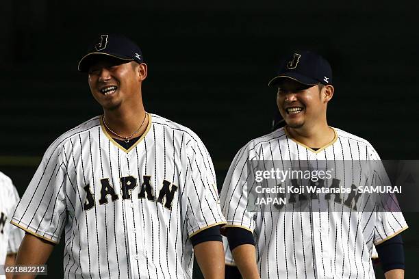 Sho Nakata and Yoshitomo Tsutsugoh of Samurai Japan looks on during the Japan national baseball team practice session at the Tokyo Dome on November...