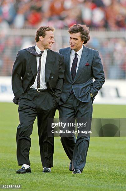 Marseille president Bernard Tapie and forward Jean- Pierre Papin chat before the European Cup semi final second leg between Benfica and Portugal on...