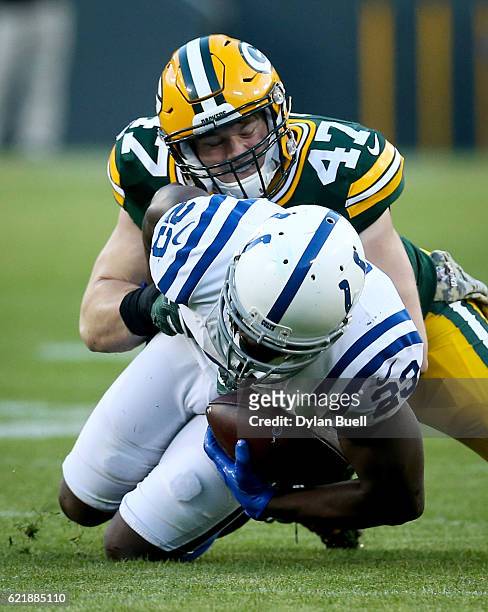 Jake Ryan of the Green Bay Packers tackles Frank Gore of the Indianapolis Colts in the first quarter at Lambeau Field on November 6, 2016 in Green...