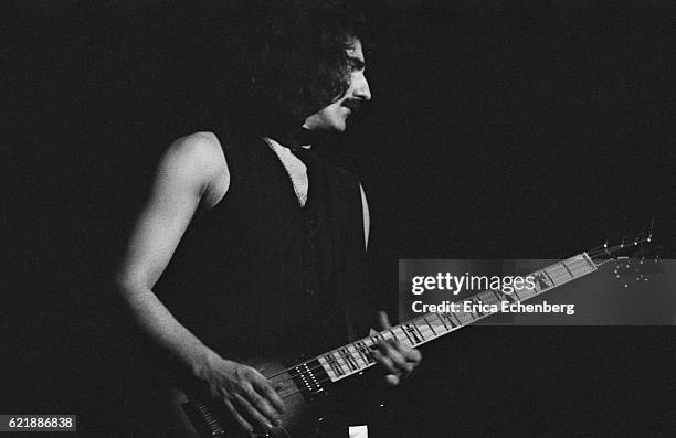 Bassist Geezer Butler of Black Sabbath performs on stage at Hammersmith Odeon, London, January 1976.
