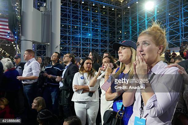 Democratic Party's presidential nominee Hillary Clinton's supporters show their sorrow as the results indicate the Republican Party's presidential...