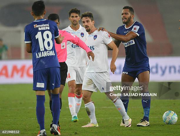 Delhi Dynamos FC forward Marcelo Leite reacts towards Chennaiyin FC midfielder Siam Hanghal during the Indian Super League football match between...