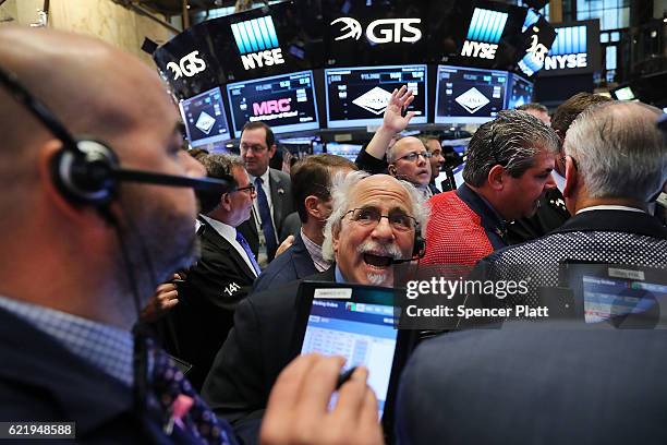 Traders work on the floor of the New York Stock Exchange the morning after Donald Trump won a major upset in the presidential election on November 9,...