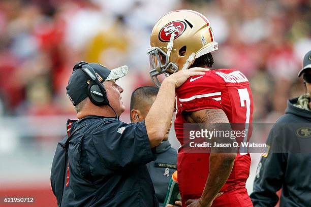 Head coach Chip Kelly of the San Francisco 49ers talks to quarterback Colin Kaepernick during the third quarter against the New Orleans Saints at...