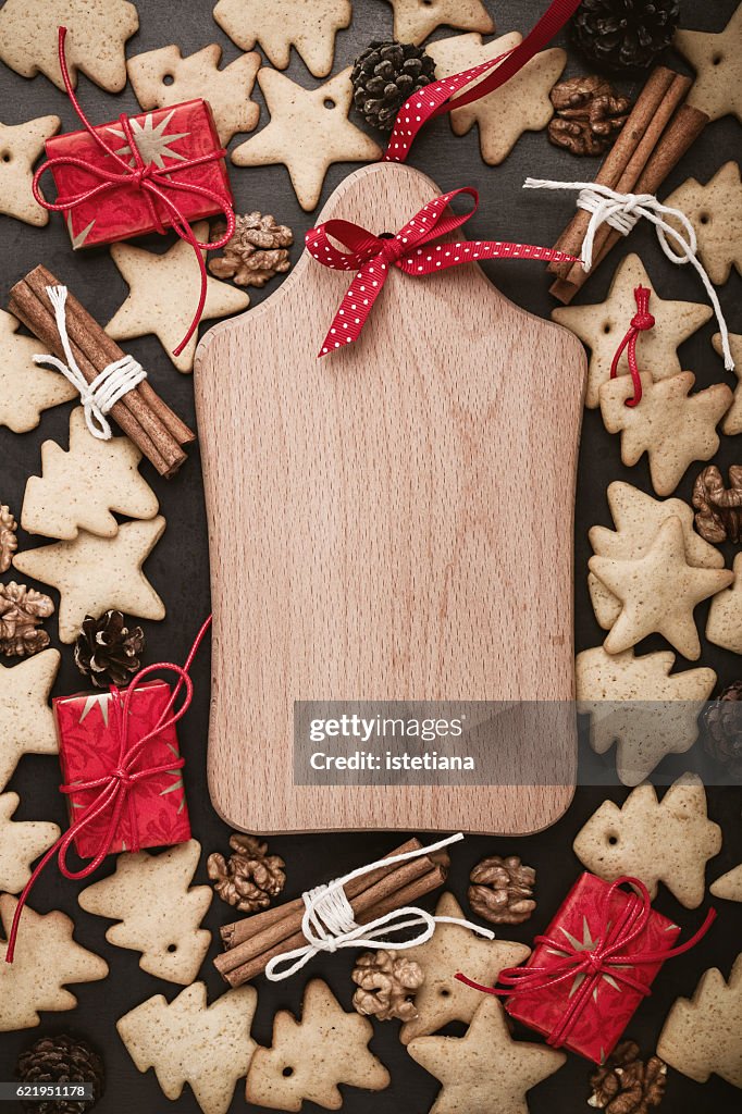 Homemade gingerbread cookies and cutting board with copy space