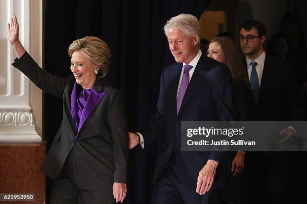 Former Secretary of State Hillary Clinton, accompanied by her husband former President Bill Clinton, takes the stage to concede the presidential...