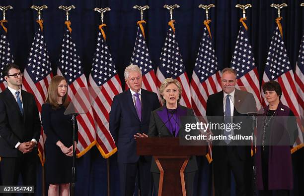 Former Secretary of State Hillary Clinton concedes the presidential election as Marc Mezvinsky, Chelsea Clinton, Bill Clinton, Tim Kaine and Anne...