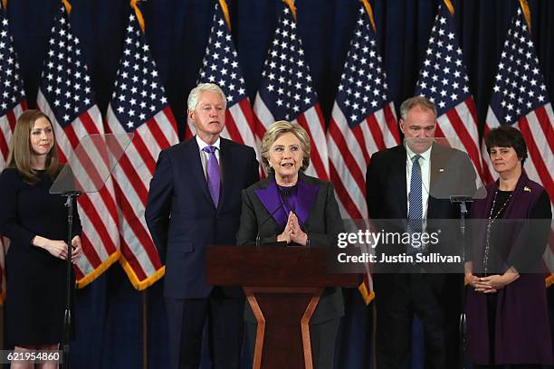 Former Secretary of State Hillary Clinton concedes the presidential election as Chelsea Clinton, Bill Clinton, Tim Kaine and Anne Holton listen at...