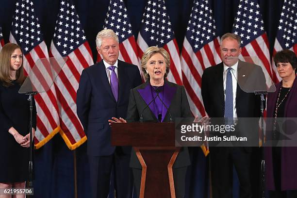 Former Secretary of State Hillary Clinton concedes the presidential election as Chelsea Clinton, Bill Clinton, Tim Kaine and Anne Holton listen at...