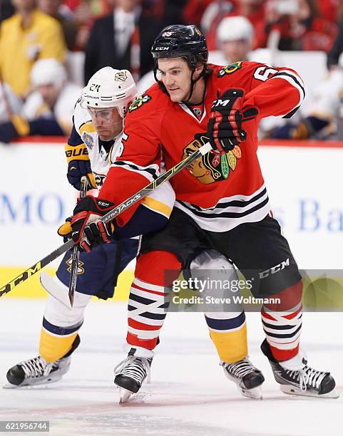 Andrew Shaw of the Chicago Blackhawks plays in the game against Eric Nystrom of the Nashville Predators at the United Center on December 8, 2015 in...