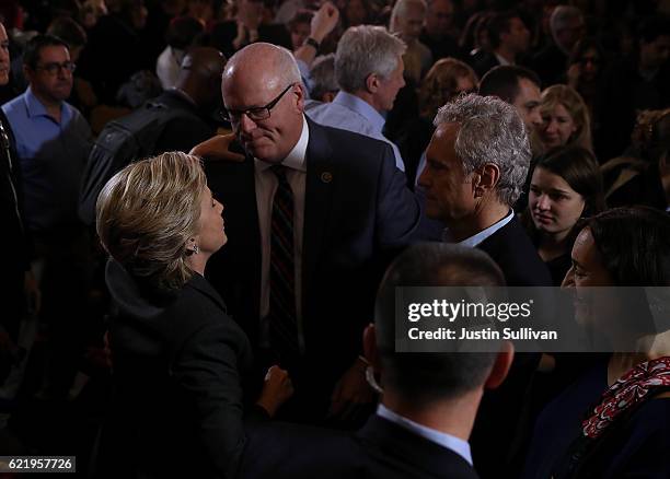 Former Secretary of State Hillary Clinton greets supporters and members of her staff during a news conference at the New Yorker Hotel on November 9,...