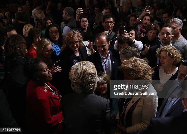 Former Secretary of State Hillary Clinton greets supporters and members of her staff during a news conference at the New Yorker Hotel on November 9,...