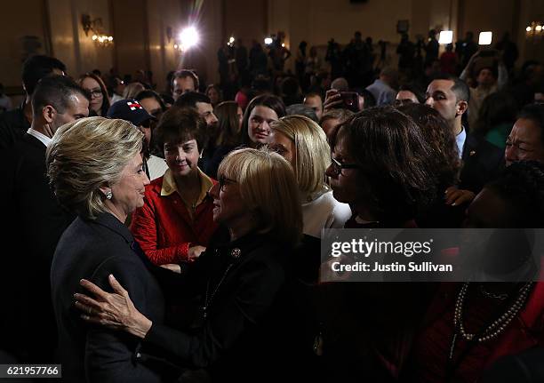 Former Secretary of State Hillary Clinton greets supporters and members of her staff during a news conference at the New Yorker Hotel on November 9,...