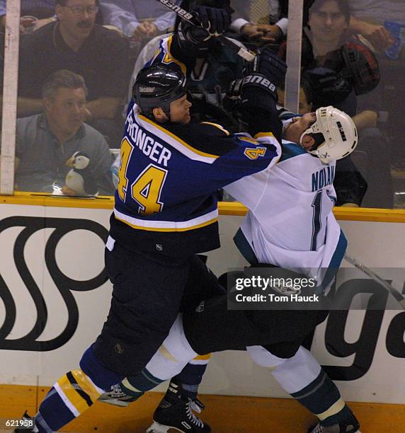 Olan Nolan of the San Jose Sharks collides with Chris Pronger of the St. Louis Blues during period two of game 4 of the Wester Conference Playoff...