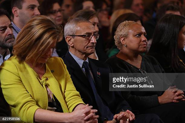 John Podesta looks on as former Secretary of State Hillary Clinton speaks during a news conference at the New Yorker Hotel on November 9, 2016 in New...