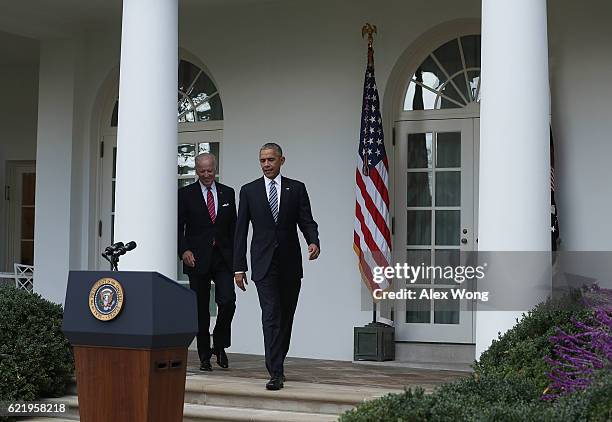 President Barack Obama and Vice President Joseph Biden approach the podium to make a statement on the election results in the Rose Garden at the...