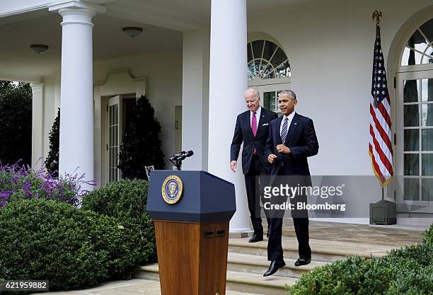 President Barack Obama, right, and U.S. Vice President Joe Biden arrive to speak to the media in the Rose Garden at the White House in Washington,...
