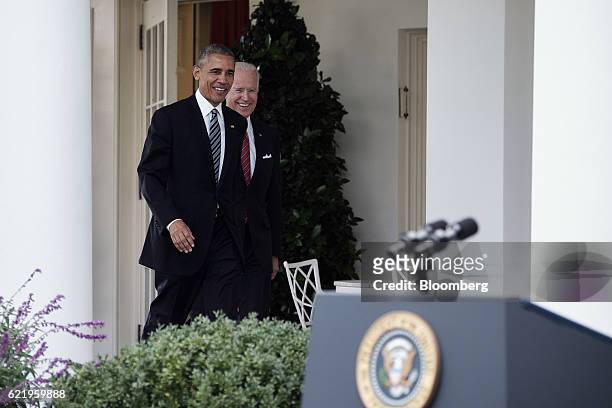 President Barack Obama, left, and U.S. Vice President Joe Biden arrive to speak to the media in the Rose Garden at the White House in Washington,...