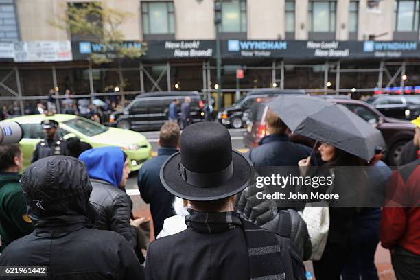 People line a Manhattan street to glimpse former Democratic Presidential candidate Hillary Clinton, who met supporters on November 9, 2016 in New...