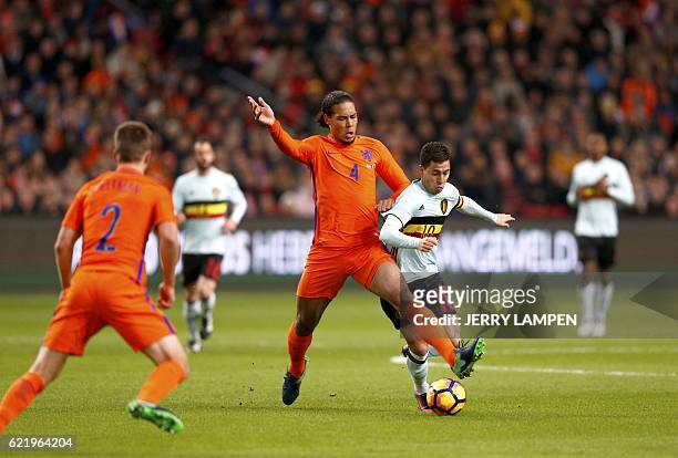 Dutch national football team player Virgil van Dijk vies with Eden Hazard of Belgium during a friendly football match between The Netherlands and...