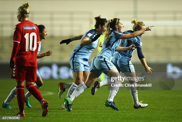 Keira Walsh of Manchester City Women celebrates with team mates as she scores their first goal during the UEFA Women's Champions League round of 16,...