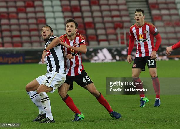 Josh Robson of Sunderland competes with Alan Smith of Notts County during the Checkatrade Trophy group stage match between Sunderland and Notts...